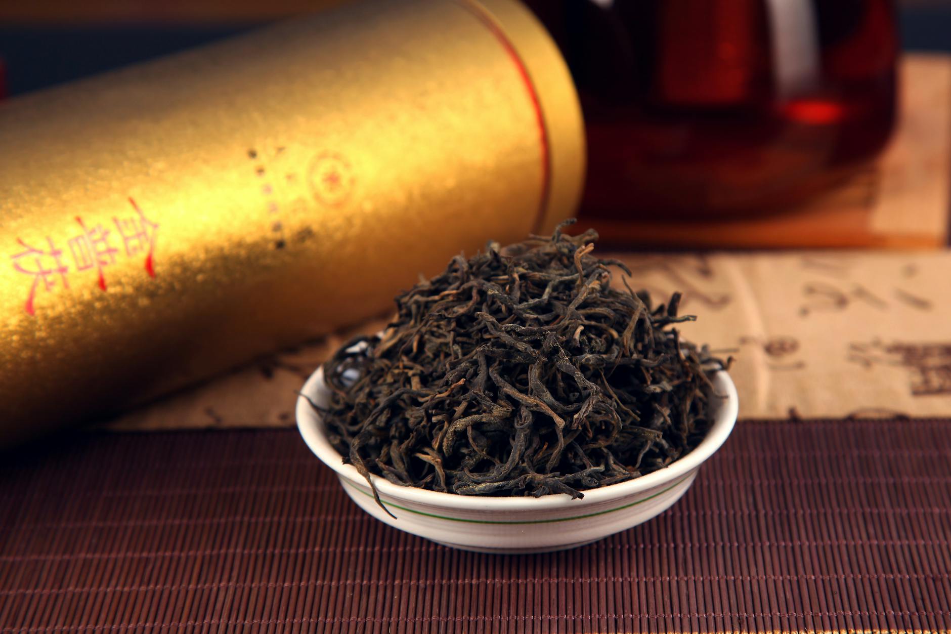 Dried herbal ingredients in traditional bowl representing Chinese medicinal formulas